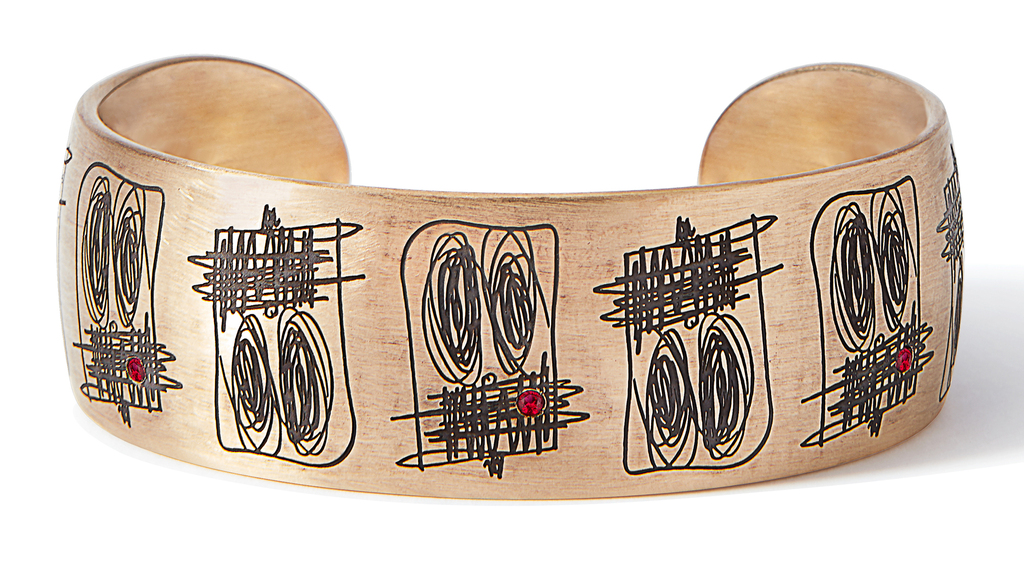 Rashid Johnson x LizWorks 9-karat gold cuff from “Anxious Men,” featuring rhodium engraving, red enamel, and five rubies weighing total 0.3 carats; edition of 15; $18,500. (Image courtesy of Sotheby’s)