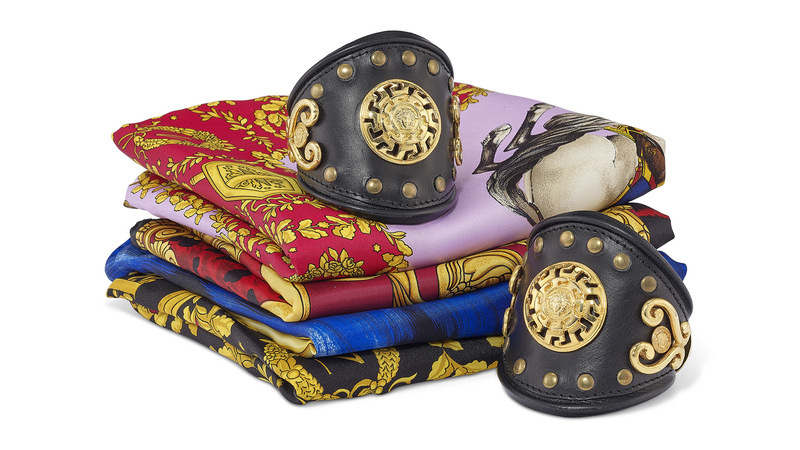 A pair of Gianni Versace Intimo gilt metal and leather cuffs are being sold alongside four silk scarves; the bracelets are from the 1993 Miami collection. The lot’s pre-sale estimate is $600-$800. (Photo credit: Christie’s Images Ltd. 2023)
