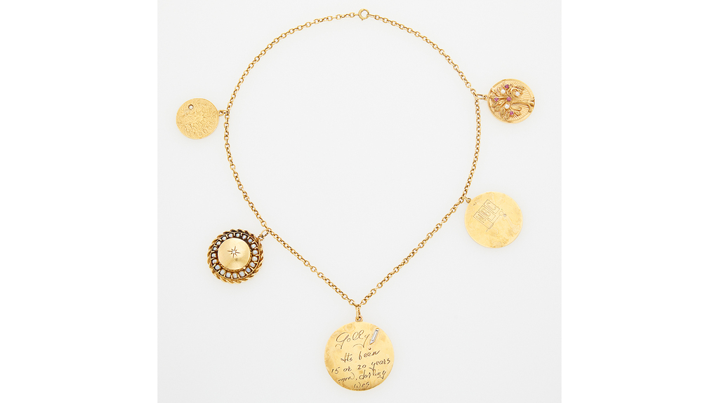 This five-charm, oval link chain necklace sold above estimate for $2,142. This five-charm, oval link chain necklace sold above estimate for $2,142.