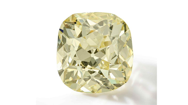 This unmounted 83.26-carat old-mine-cut fancy yellow diamond garnered $1.4 million.