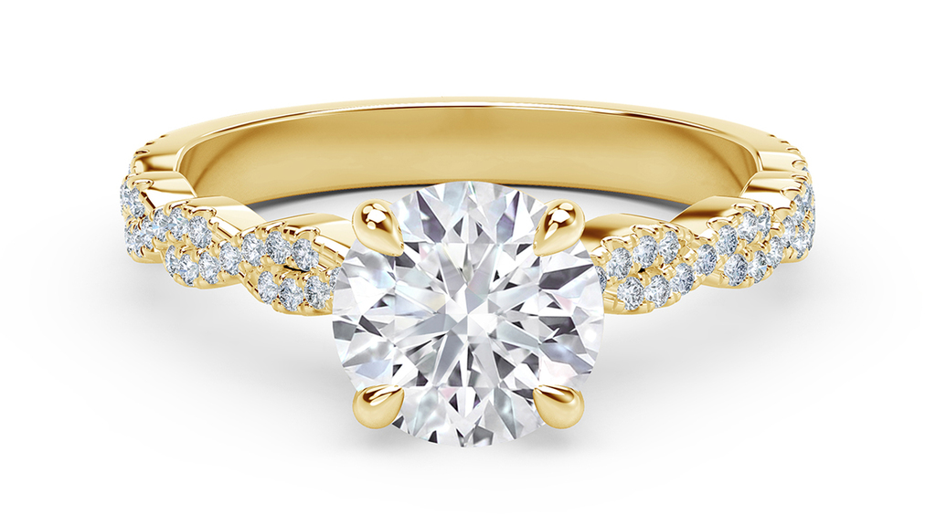 De Beers Forevermark “Icon” engagement ring in 18-karat yellow gold with round diamond and twisted diamond band (starting at $4,700)