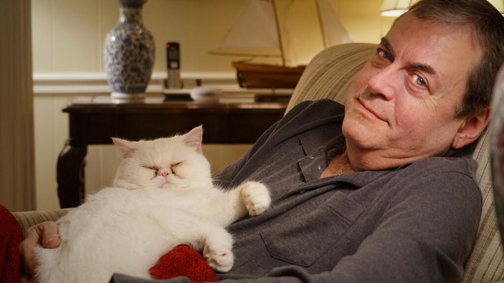 Brian Mann with his cat, Sweetpea