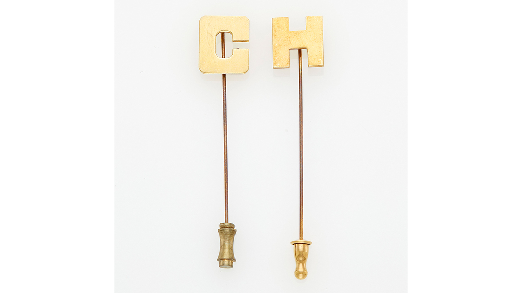 A pair of 14-karat gold stick pins sold for $756. A pair of 14-karat gold stick pins sold for $756.