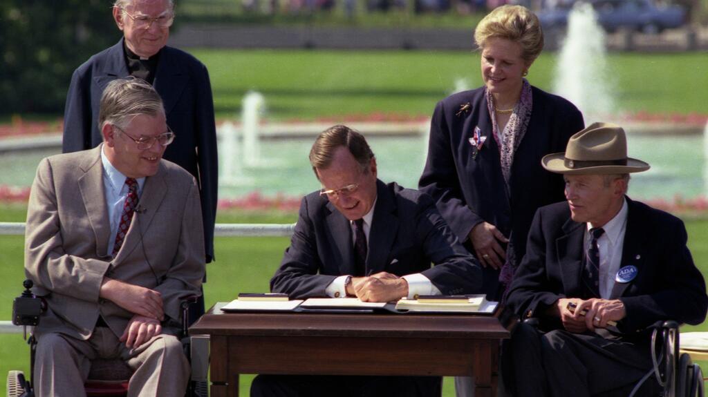 President George H. W. Bush signing the Americans with Disabilities Act