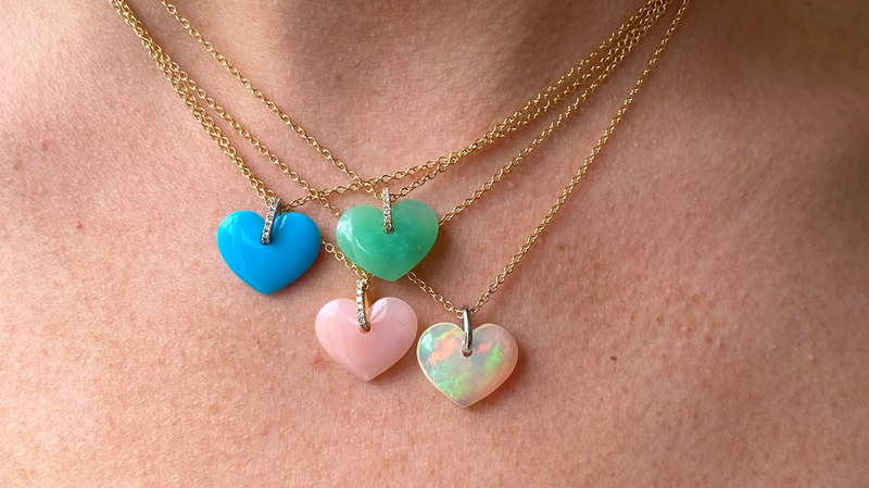 Heart pendants made of resin composite with 18-karat yellow gold bales ($350)