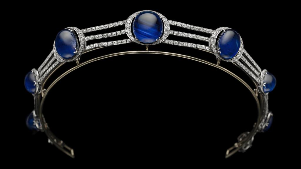 collier de chien, c. 1921, by maker Michel Ballada for Chaumet, and set with seven oval cabochon Ceylon sapphires, graduating in size—the largest weighing 47.34 carats—along three diamond-set lines and within crescent-shaped surrounds. An 8.20-carat sugarloaf sapphire decorates the clasp. Private collection