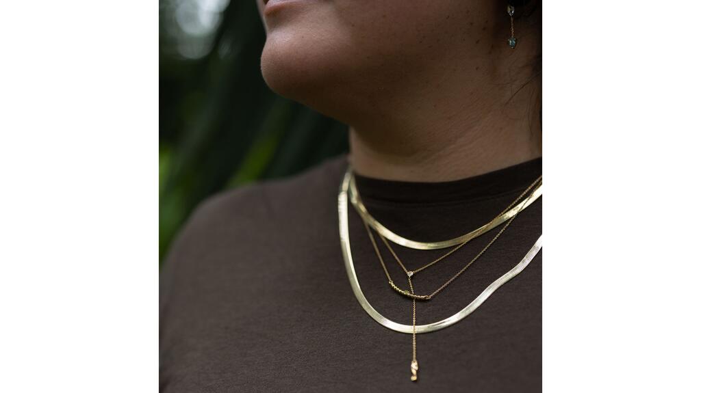 Chouette Designs necklaces on model