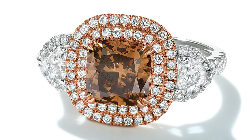 The “Avery” ring in platinum and 18-karat “Strawberry Gold” with a 2.5- carat natural color fancy dark yellowish-brown cushion-cut center stone, “Chocolate Diamonds,” 0.53 carats of heart-shaped diamonds, and 0.63 carats of round brilliant-cut Vanilla Diamonds ($28,548)