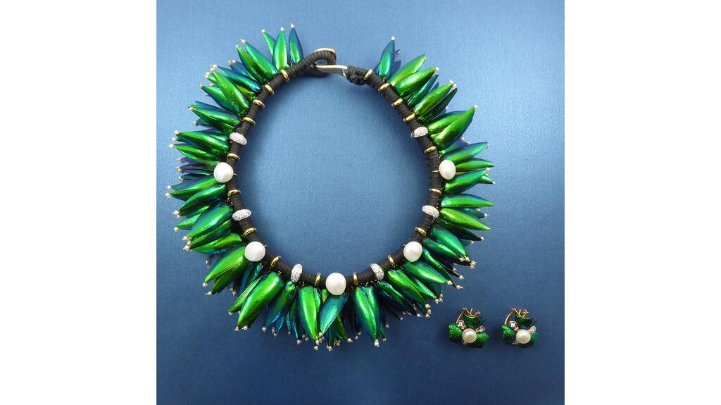This creepy-crawly find is from Lisa Kramer Vintage. Beetle wing bug necklace