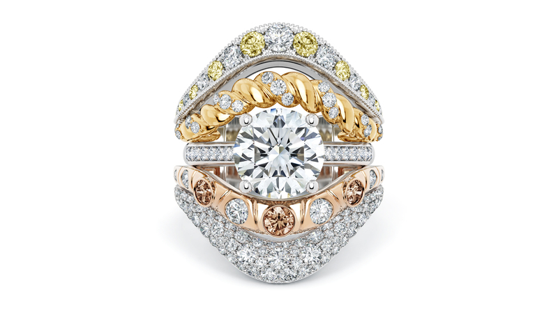 A 3.06-carat, D-color flawless diamond solitaire ring is flanked by the collection’s ring jacket.