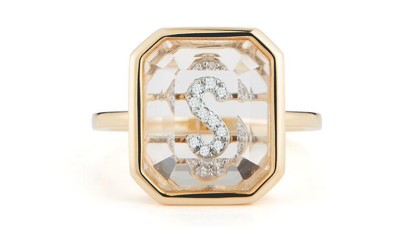 <a href="https://mateonewyork.com/collections/women-rings/products/14k-gold-frame-crystal-quartz-secret-diamond-initial-ring?variant=8393543254069" target="_blank">Mateo</a> 14-karat yellow gold “Secret Initial Ring” with quartz and diamonds ($1,675)