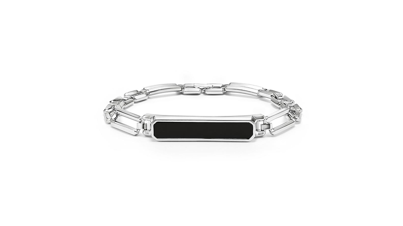 The “Homme” black onyx ID bracelet in silver, featuring the collection’s signature beveled links ($995)