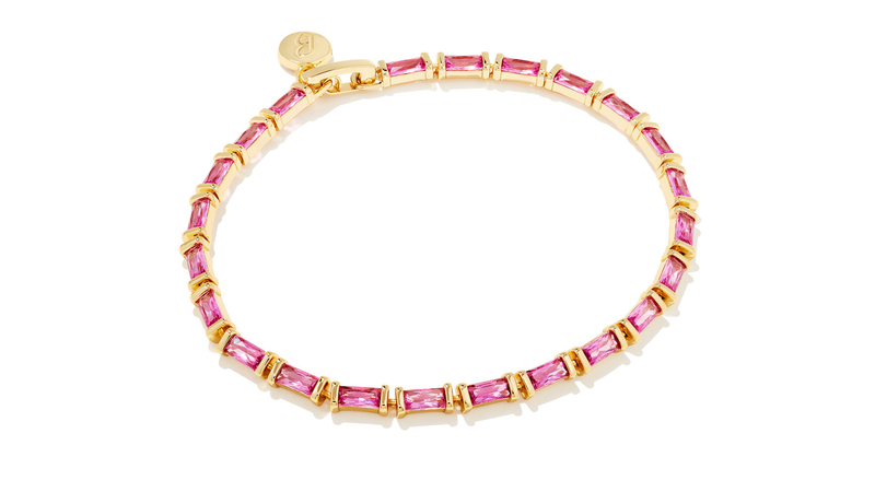 This chain bracelet ($90) from the capsule collection is brass plated with 14-karat yellow gold and set with “Barbie pink” crystals.