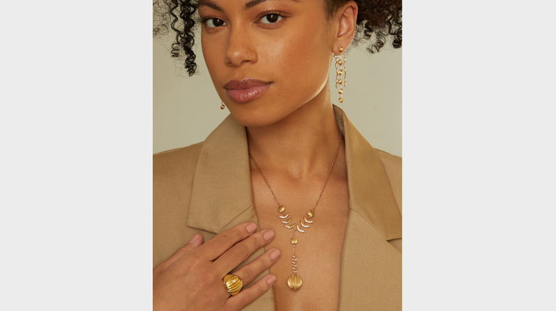 The “Tropical Trees” diamond chandelier earrings ($12,600), “Monfongo” ring ($8,400) and a necklace from Lisette Scott’s brand, Jam + Rico
