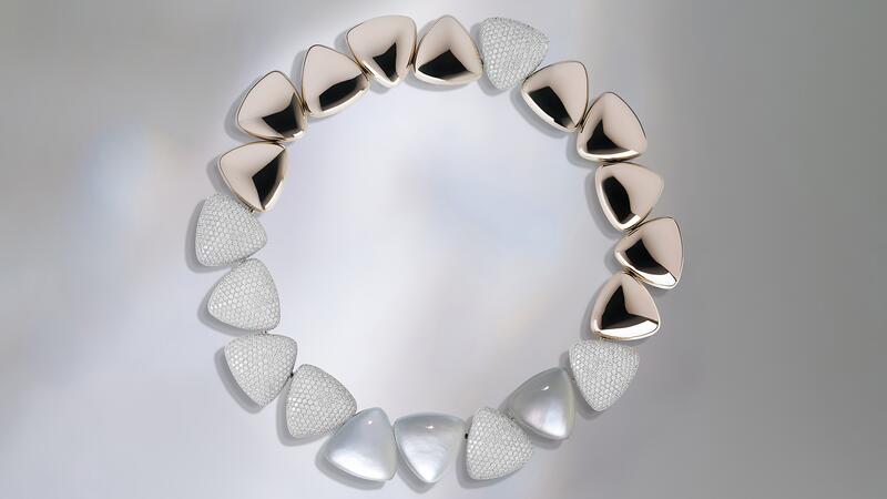 Another “Freccia” necklace style, with mirror polished white gold and full diamond pavé on the triangular elements, features mother-of-pearl and rock crystal in white gold Vhernier Freccia Necklace