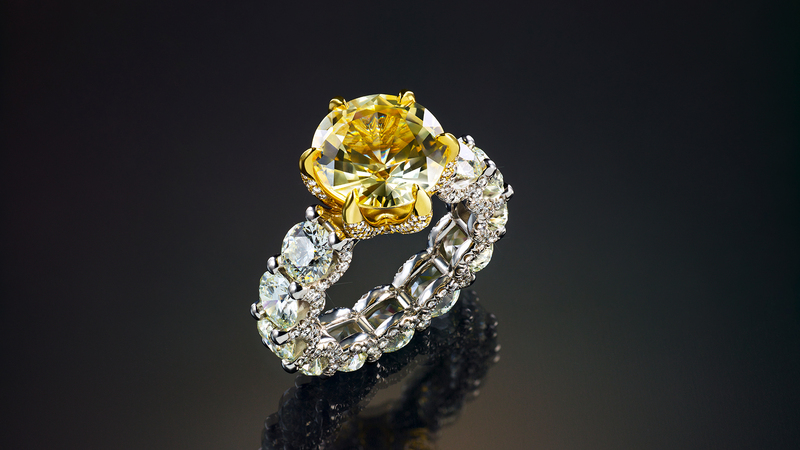 A nearly 8-carat yellow sapphire, set in 18-karat yellow gold prongs, flanked by round diamonds along the platinum band ($50,000)