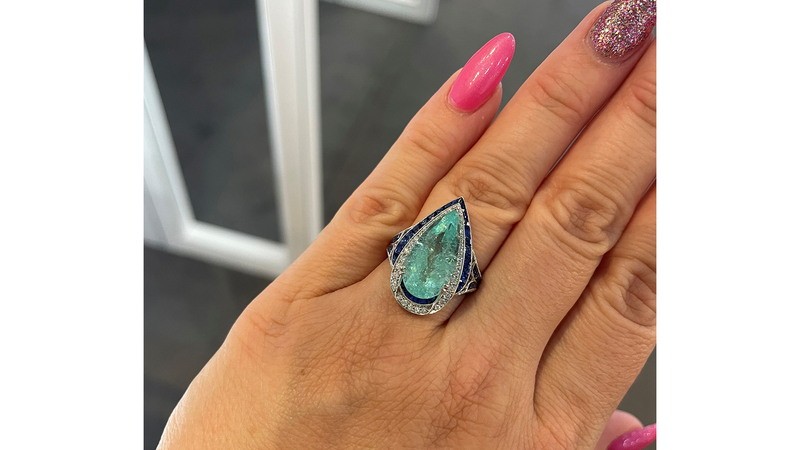 I was in love with this ring. A 5.39-carat pear-shaped Paraiba tourmaline is surrounded by Ceylon blue sapphires and diamonds ($46,800).