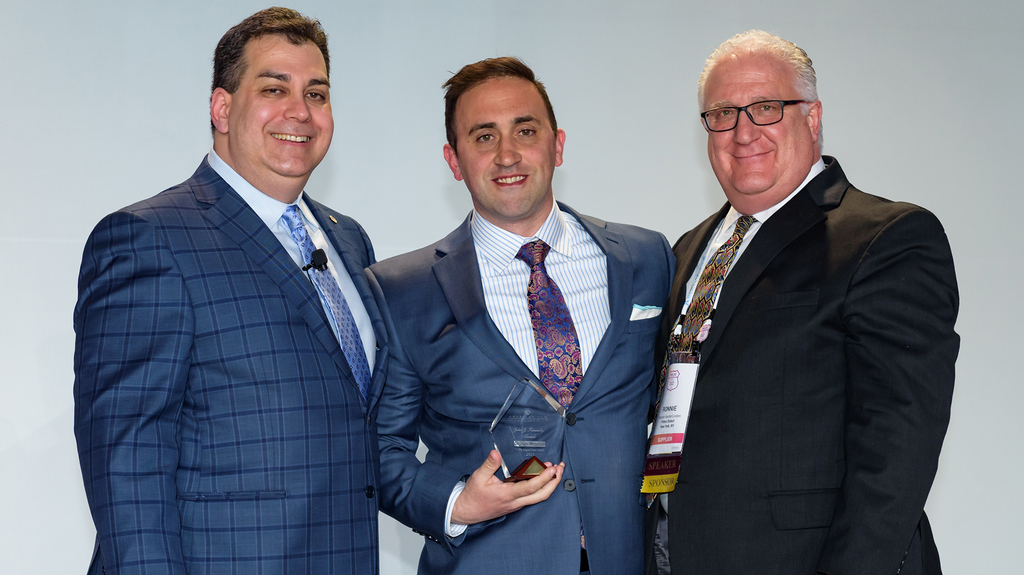 The John J. Kennedy award went to Joseph Metsopulos (center). To his left is Marc Altman, past chair of the Guild Council, and, to his right, Ronnie Vanderlinden, the Supplier’s Task Force chair. (Image courtesy of the American Gem Society)