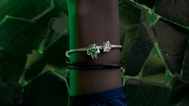 The Hulk sits beside an Avengers symbol charm on Pandora’s iconic charm bracelet.