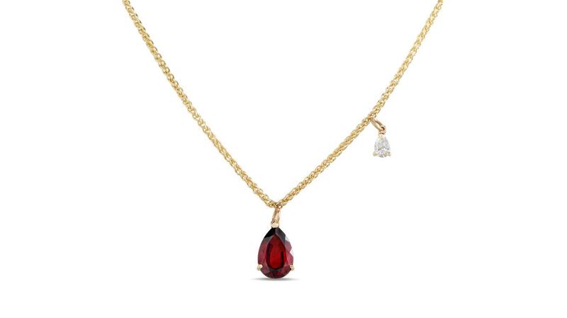 <a href="https://www.reframedjewellery.com/" target="_blank">Reframed Jewellery</a> pear-shaped red garnet pendant with diamond charm in 9-karat yellow gold ($1,062)