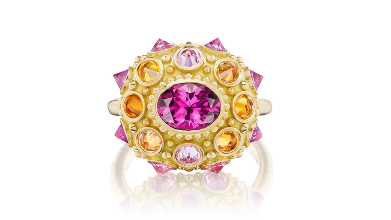 The AnaKatarina “Pretty in Pink” ring features a pink tourmaline surrounded by rhodolite garnets and orange sapphires, all set in 18-karat yellow gold ($10,310).