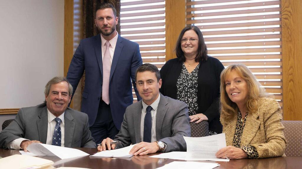 Kathy Corey, Jeff Corey, and Joseph Corey with Day’s Jewelers employees
