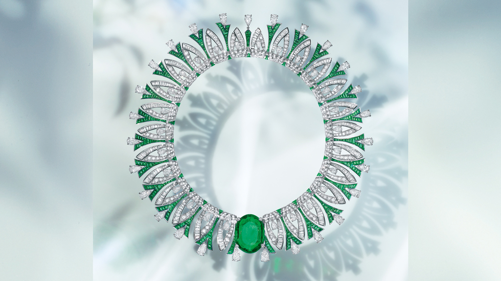 The “Tribute to Paris” necklace in platinum with an oval-cut emerald (35.53 carats), 52 pear-shaped diamonds (31.55 carats), 461 buff-top emeralds (26.63 carats), 317 fancy-shape diamonds (14.11 carats), and pavé diamonds (14.76 carats)