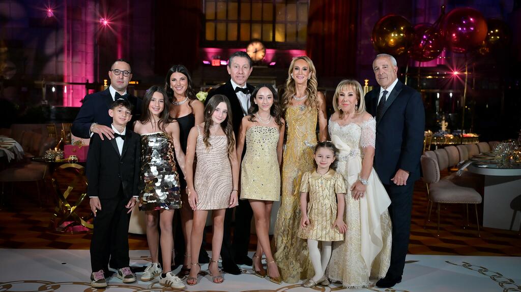 Candy and Mark (far right) with, from left, son Scott Udell and his wife Jessica Udell; son-in-law Scott Alper and daughter Randi Udell Alper; and their five grandchildren The Udell family