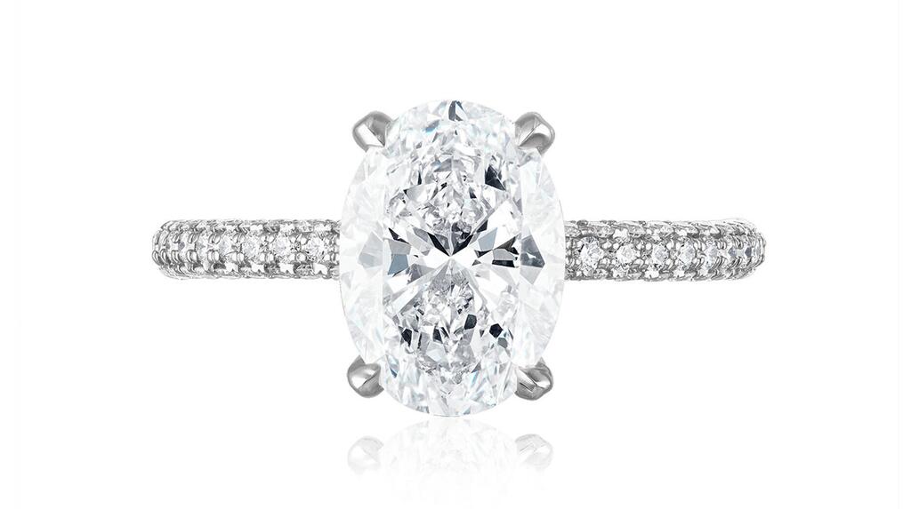 This Stephanie Gottlieb ring, similar to Simone Biles’ engagement ring, features a 2.5-carat G-color SI1 oval-shaped diamond set in the company’s signature platinum three-sided diamond pavé setting.