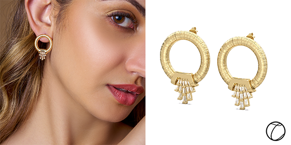 Champagne Fountaine Earrings: Our 14-Karat yellow gold Champagne Fountaine Earrings with a threaded gold finish and tapered baguette diamonds ($1,679)