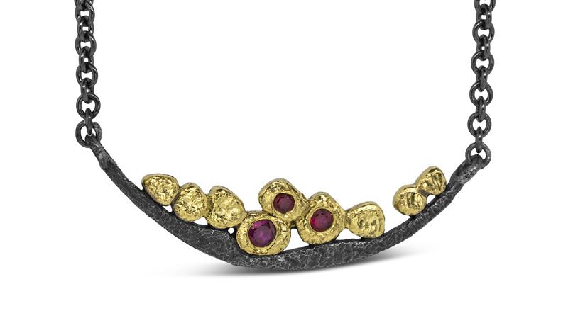 Rona Fisher “Wavy Pebbles Bar Necklace” with rubies in 18-karat yellow gold and oxidized sterling silver