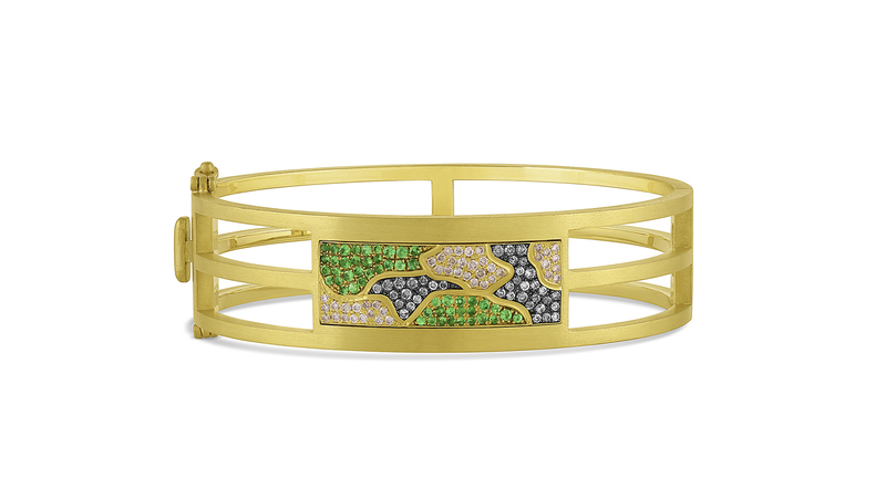The Camo cuff in 18-karat yellow gold with satin finish is set with champagne diamonds (0.28 carats), gray diamonds (0.28 carats), and tsavorites (0.53 carats). It retails for $24,440.