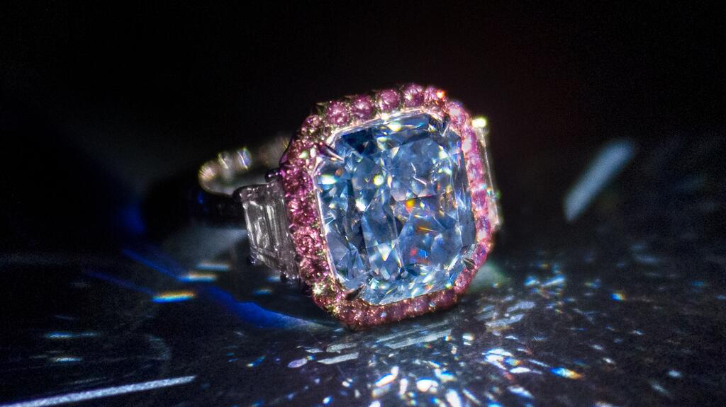 The 11.28-carat “Infinite Blue” was specifically cut to include the number “8” in its final carat weight, which is an auspicious number in Asia. It is a cut-cornered rectangular mixed-cut diamond. Infinite Blue diamond Sotheby’s Hong Kong