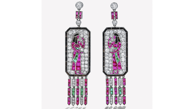 These Lacloche Frères ear clips depict two Egyptian figures and are set with old European- and single-cut diamonds, buff-top emeralds, rubies, and onyx, with articulated fringe set with diamonds, emeralds, and rubies. They sold for $352,800.