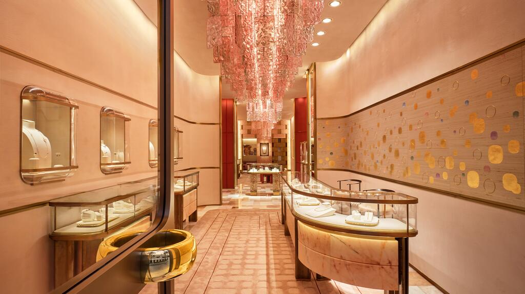 The interior is decorated with painted and embroidered silk wallpapers inspired by Pomellato’s “Nudo” collection (right) and a Paysage chandelier crafted from Murano glass. Pomellato Rodeo Drive Flagship Interior