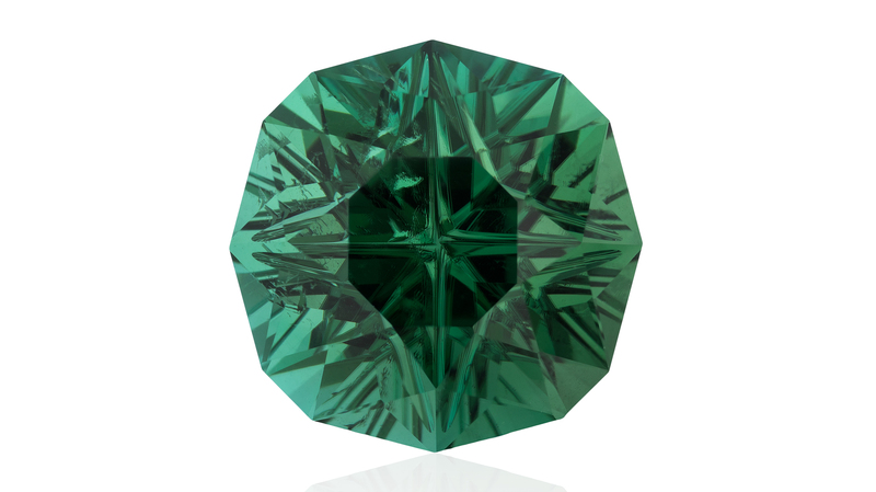 Innovative Faceting, First Place. Larry Woods 43.80-carat “Celestial Compass Rose” specialty cut green tourmaline