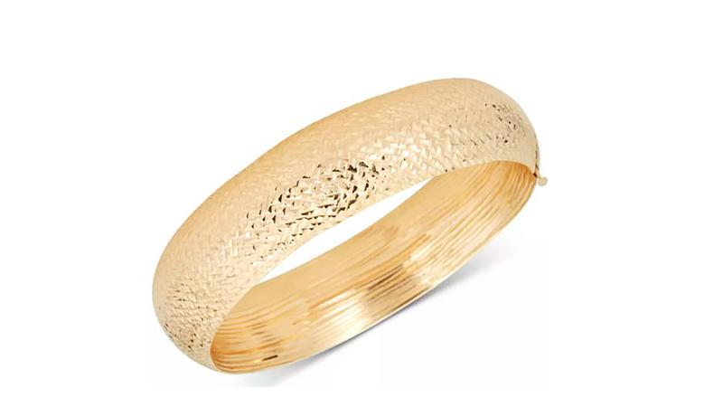 A Macy’s brand diamond-cut wide bangle bracelet in 14-karat gold ($1,500). (Image courtesy of Macy’s website)