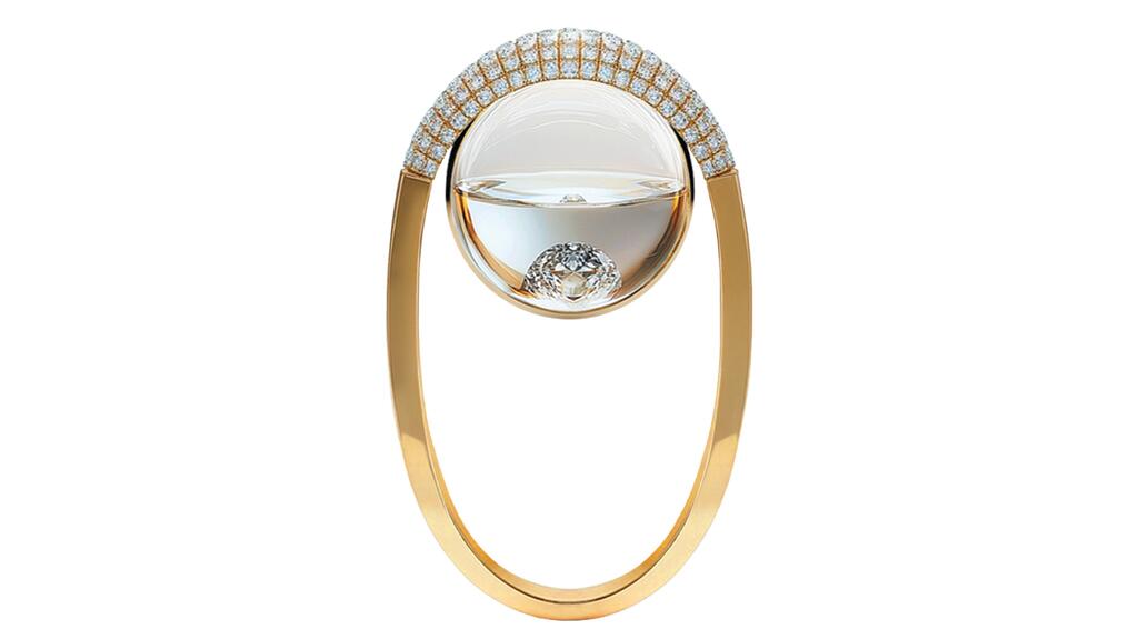 From the “Amarleau” collection is Chrstns’ “IMA” ring in 18-karat yellow gold with diamond accents and a sapphire crystal sphere filled with water and a diamond ($16,990) Chrstns IMA Ring
