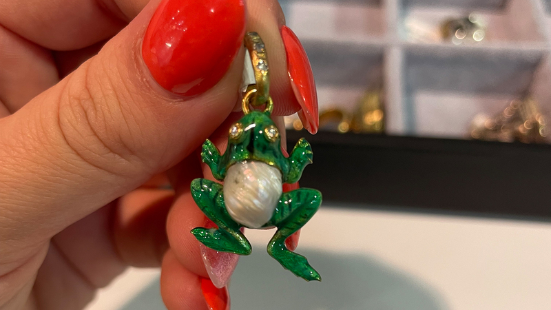 An adorable frog pendant, converted from a stick pin, in 14-karat gold and enamel with a natural pearl belly