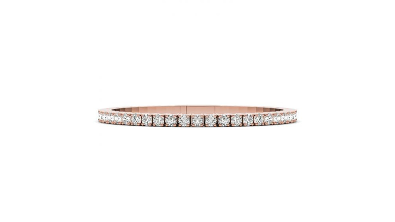 A 14-karat rose gold flexible bangle, set with round lab-grown diamonds weighing 4 carats ($3,529)