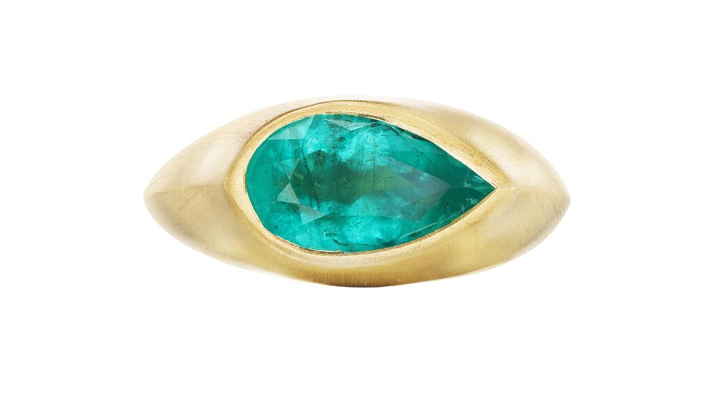 Ophelia Eve’s “Iris II” signet ring with a 3.05-carat pear-shaped Brazilian emerald set in 18-karat brushed yellow gold ($8,080) Ophelia Eve Iris II Signet Ring