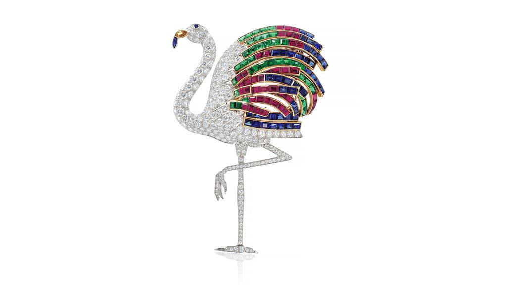 The flamingo brooch by Cartier is set with rubies, sapphires, diamonds, and emeralds. Cartier flamingo gem brooch