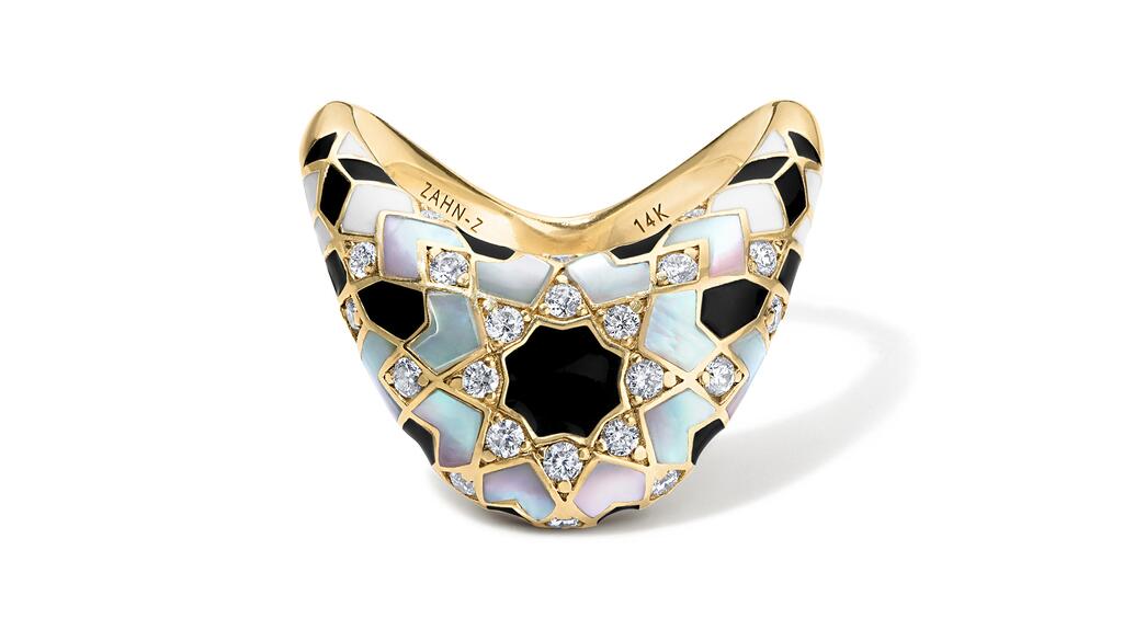“Big Zaha Secrets Revealed” ring in 14-karat yellow gold with black enamel, mother-of-pearl, and diamonds ($6,400) Zahn-Z Big Zaha Secrets Revealed Ring