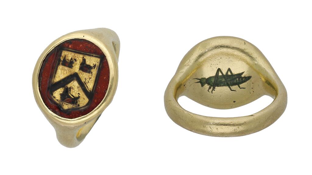 This form of signet ring features foil behind the rock crystal bezel to tint the colors of the coat of arms, allowing impressions to be taken without exposing the colors to hot wax, according to the auction catalog. Gresham grasshopper 16th century signet ring