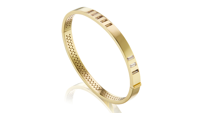 <a href="https://harwellgodfrey.com/collections/jewelry-bracelets/products/juju-bangle-parallel-lines-diamond-and-smokey-topaz" target="_blank">Harwell Godfrey</a> “Juju Bangle” in 18-karat yellow gold with diamonds and smokey topaz ($11,050)