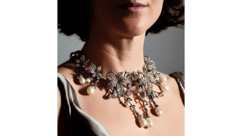 A model wearing the jewel as a necklace (Photo courtesy of Sotheby’s) Natural pearl and diamond piece as necklace