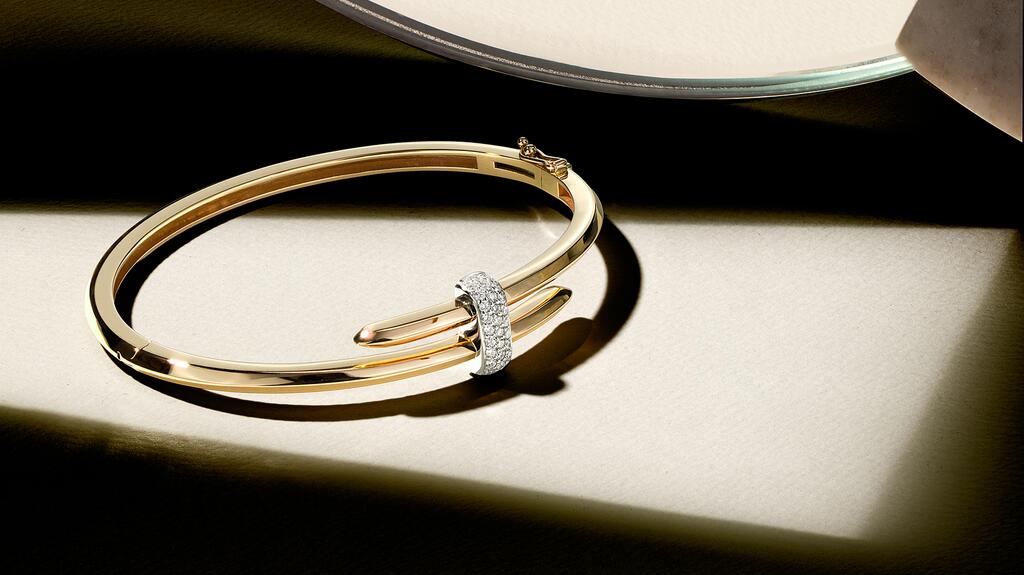 A gold wrap bangle with diamond pavé from Ecksand’s “Duel” collection Ecksand bangle
