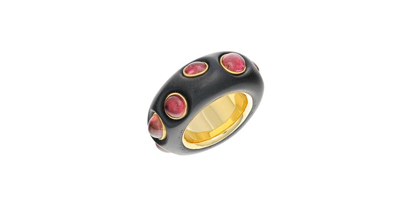 This “Succulent” ring by Everett Walker Redus features 18-karat yellow gold, fine and sterling silver, and ebony wood, set with 30 carats of round and oval cabochon rubellite tourmaline.