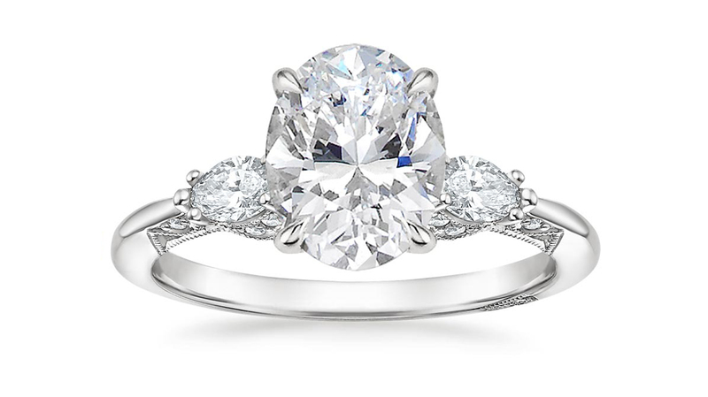 A three-stone ring with marquise-shaped side stones