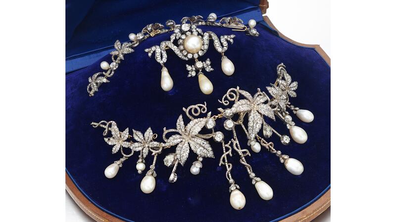 Kunigunde of Saxony, Marchesa di Montoro’s natural pearl and diamond wedding tiara from 1796 was turned into a Sévigné-style hair ornament that was later altered so it could transform into a necklace, a devant-de-corsage, and a set of hair pins. The brooch pictured at center was made later. (Photo courtesy of Sotheby’s) Natural pearl and diamond piece in box